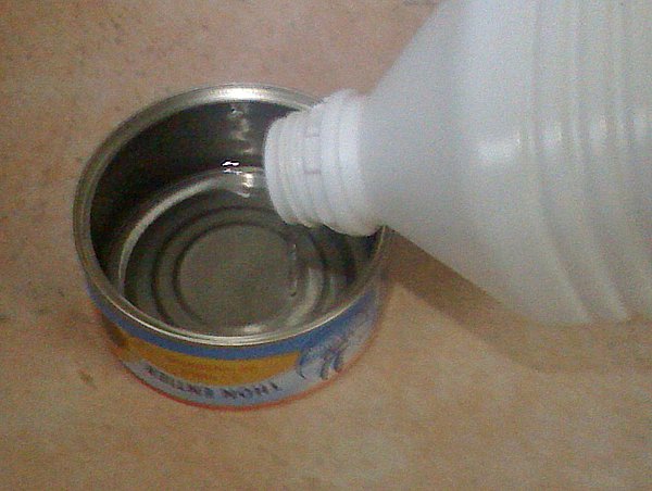 Pour alcohol in the small can